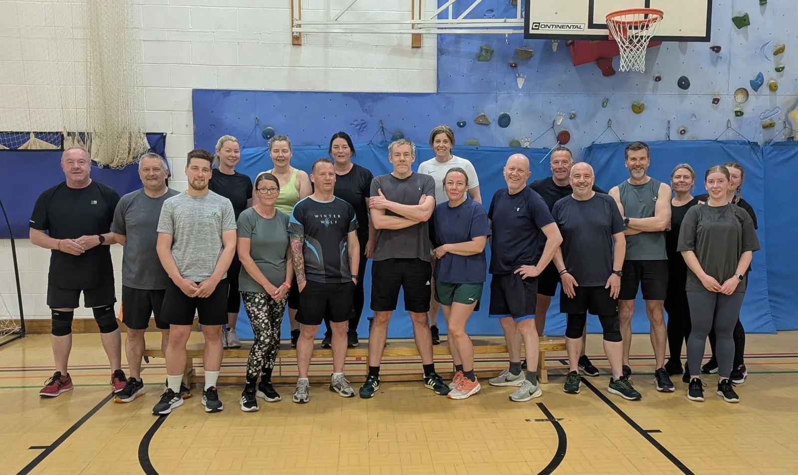 Paul's class group lined up together in the sports hall after a session
